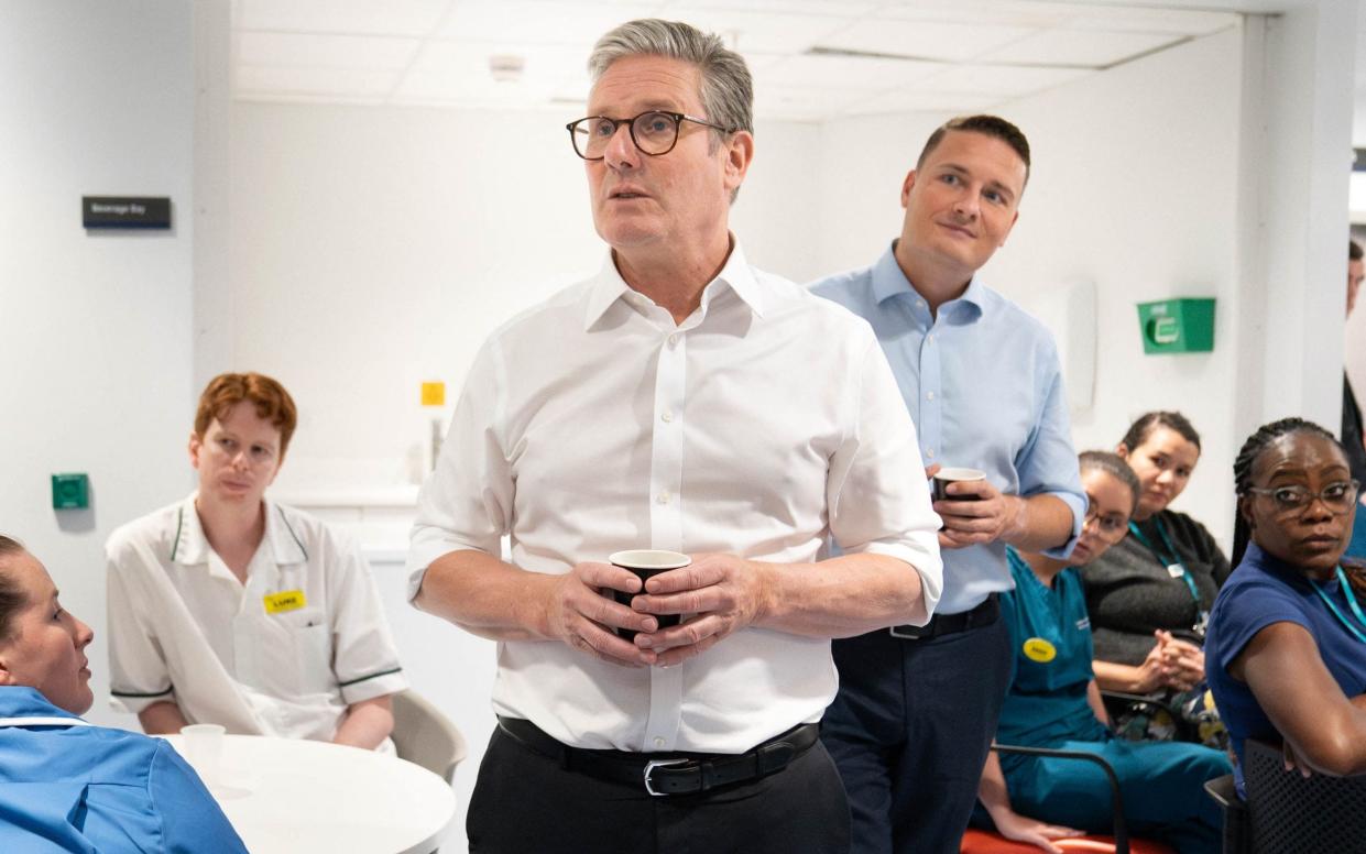 Prime Minister Keir Starmer and Health Secretary Wes Streeting react during a visit to University College London Hospital