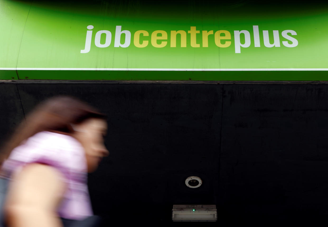  unemployment rate A woman walks past a branch of Jobcentre Plus, a government run employment support and benefits agency, as the outbreak of the coronavirus disease (COVID-19) continues, in Hackney, London, Britain, August 6, 2020. REUTERS/John Sibley