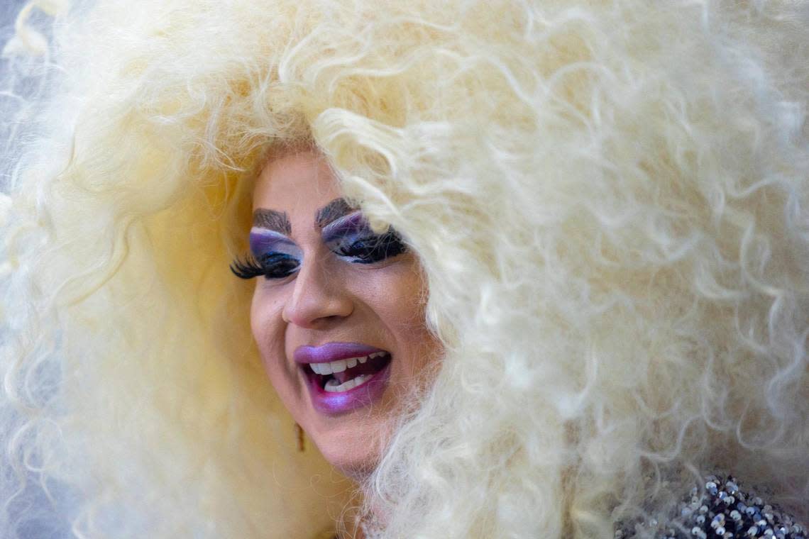 Drag performer May O’Nays sings before a LGBTQ rally in the rotunda at the Kentucky state Capitol in Frankfort, Ky., on Wednesday, Feb. 21, 2024.