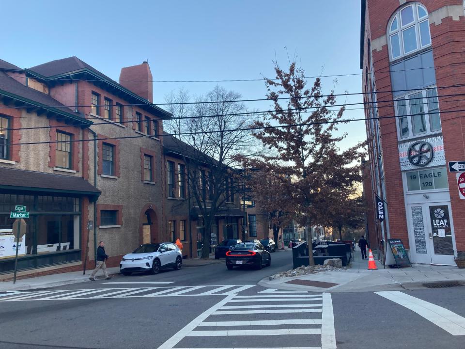 The YMI Cultural Center (left) and the LEAF Global Arts building (right) at the intersection of Eagle Street and South Market Street on Nov. 29, 2023.