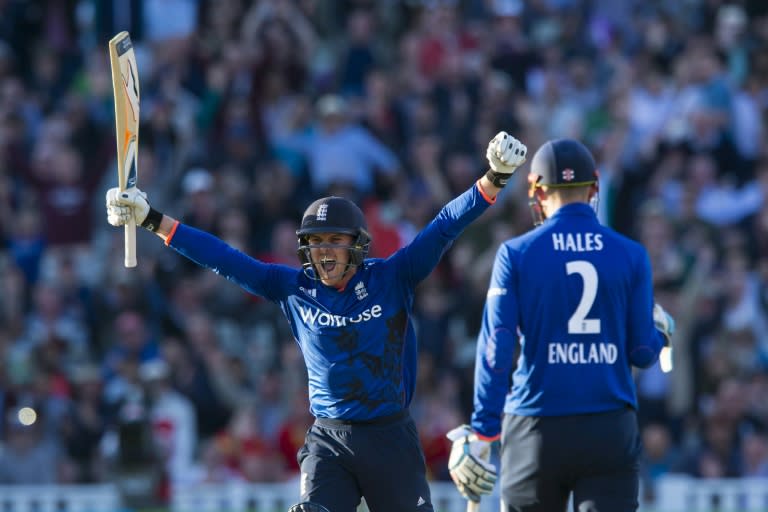 England's Jason Roy (L) celebrates reaching his century during play in the second one day international (ODI) between England and Sri Lanka at Edgbaston cricket ground in Birmingham, on June 24, 2016