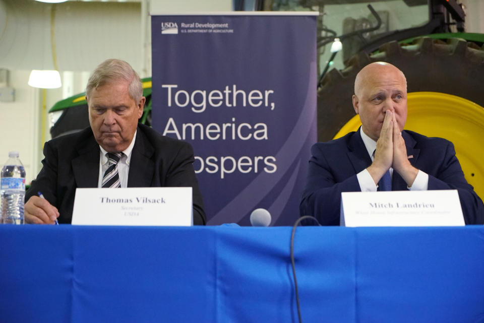 U.S. Agriculture Sec. Tom Vilsack, left, and Mitch Landrieu, White House senior adviser, listen at a community panel on rural high-speed internet at Wake Tech Community College in Raleigh, N.C., on Thursday, Oct. 27, 2022. (AP Photo/Allen G. Breed)