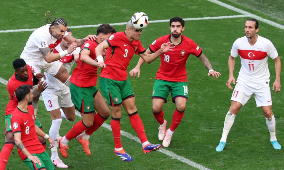 <span>Pepe clears the ball away from danger during Portugal’s game against Turkey.</span><span>Photograph: Christopher Neundorf/EPA</span>