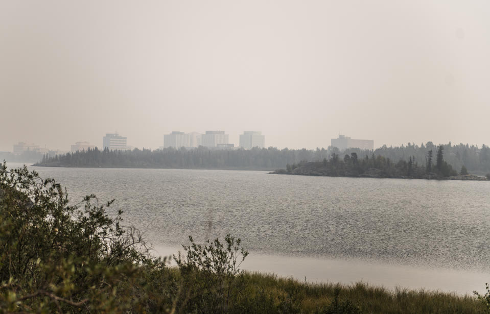 Heavy smoke from nearby wildfires fills the sky in Yellowknife on Tuesday, August 15, 2023. THE CANADIAN PRESS/Angela Gzowski