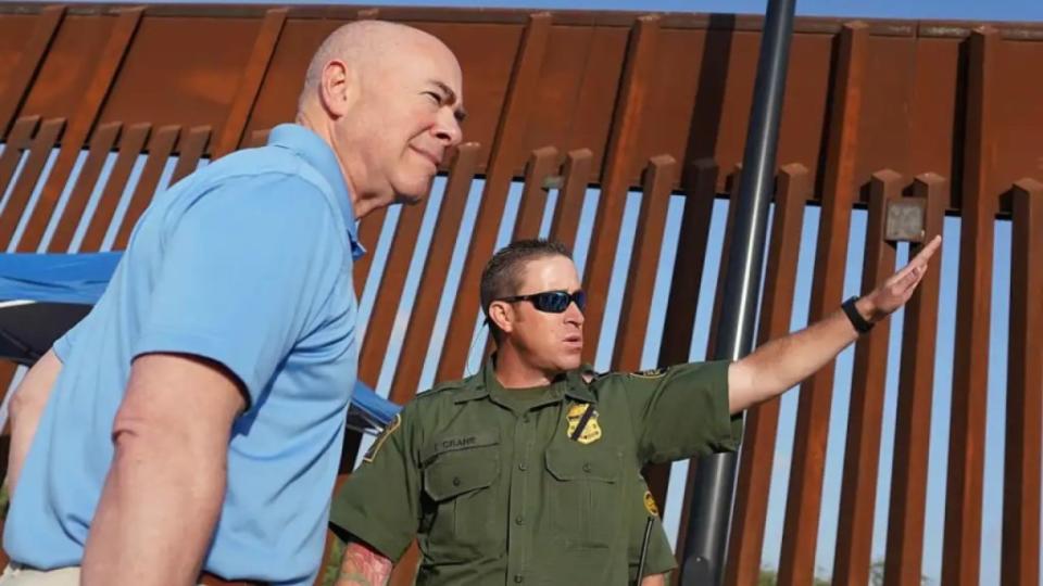 Homeland Security Secretary Alejandro Mayorkas (left) listens to Anthony Crane, of U.S. border patrol, as he tours a border wall section in Hidalgo, Texas, in 2022. (Photo: Joel Martinez/The Monitor via AP, Pool)