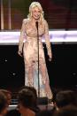 <p>Dolly delights the audience at the 23rd Screen Actors Guild Awards in 2017. Here, country glamour is perfected with this beaded, lacy ensemble in a peachy-keen hue. </p>