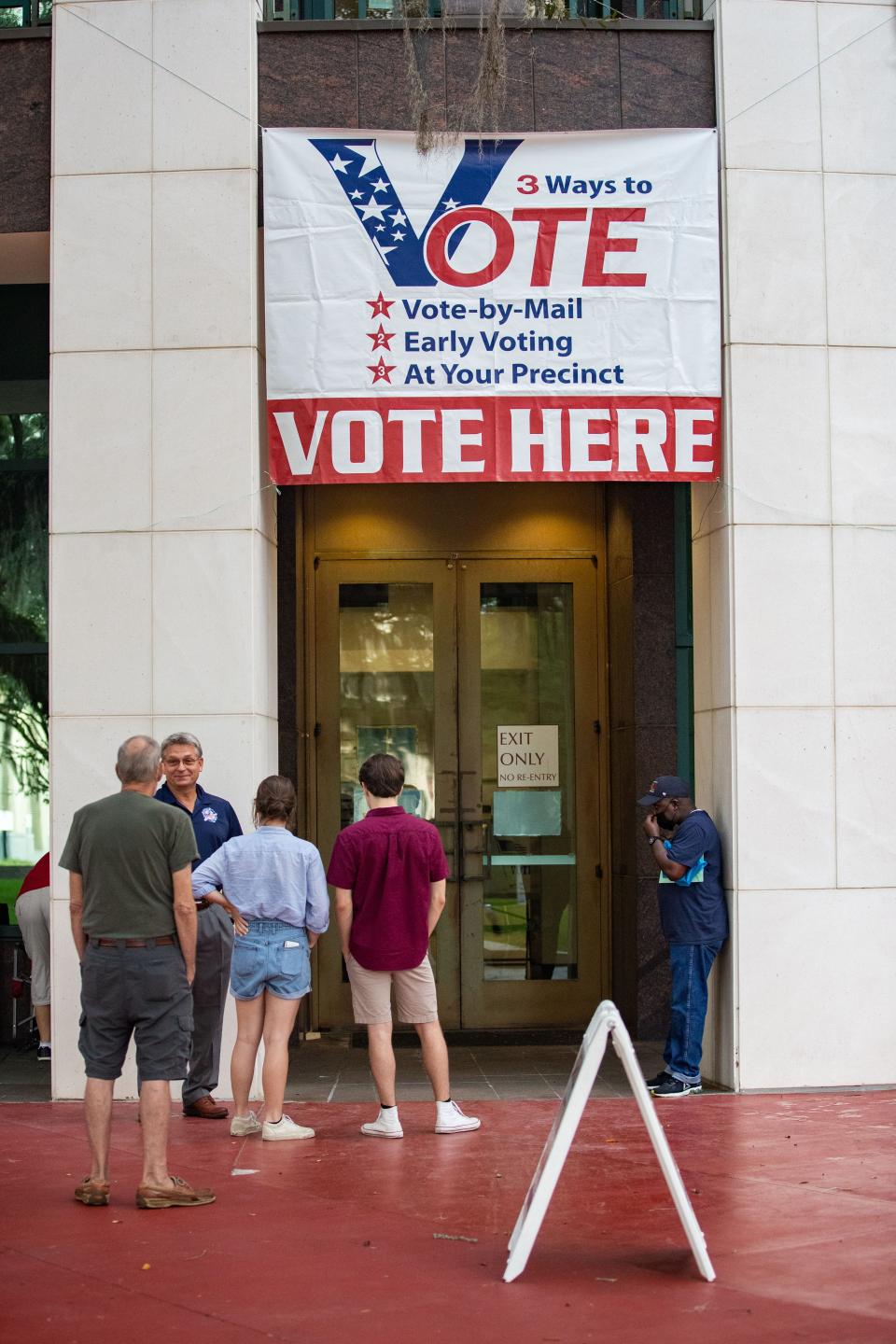 Leon County citizens lineup outside the Leon County Courthouse before the voting site opened for early voting Saturday, Aug. 13, 2022.