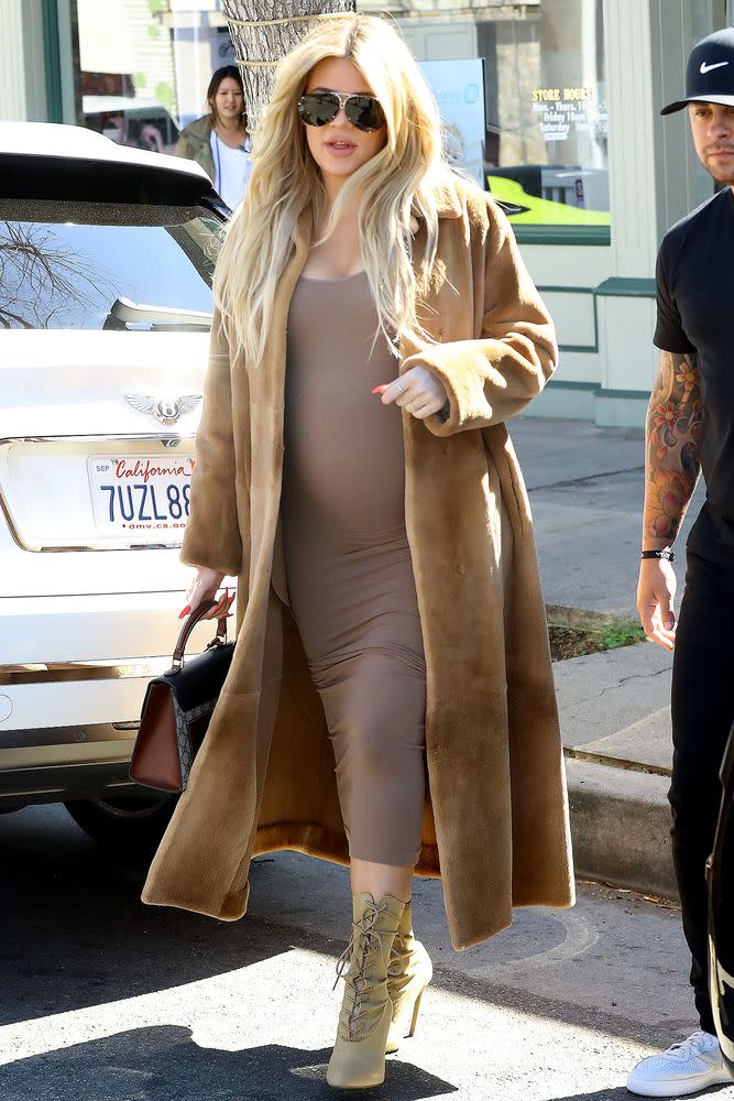 Pregnant Khloé Kardashian Takes Maternity Style Cues From Sister Kim In Midi Dress And Overcoat