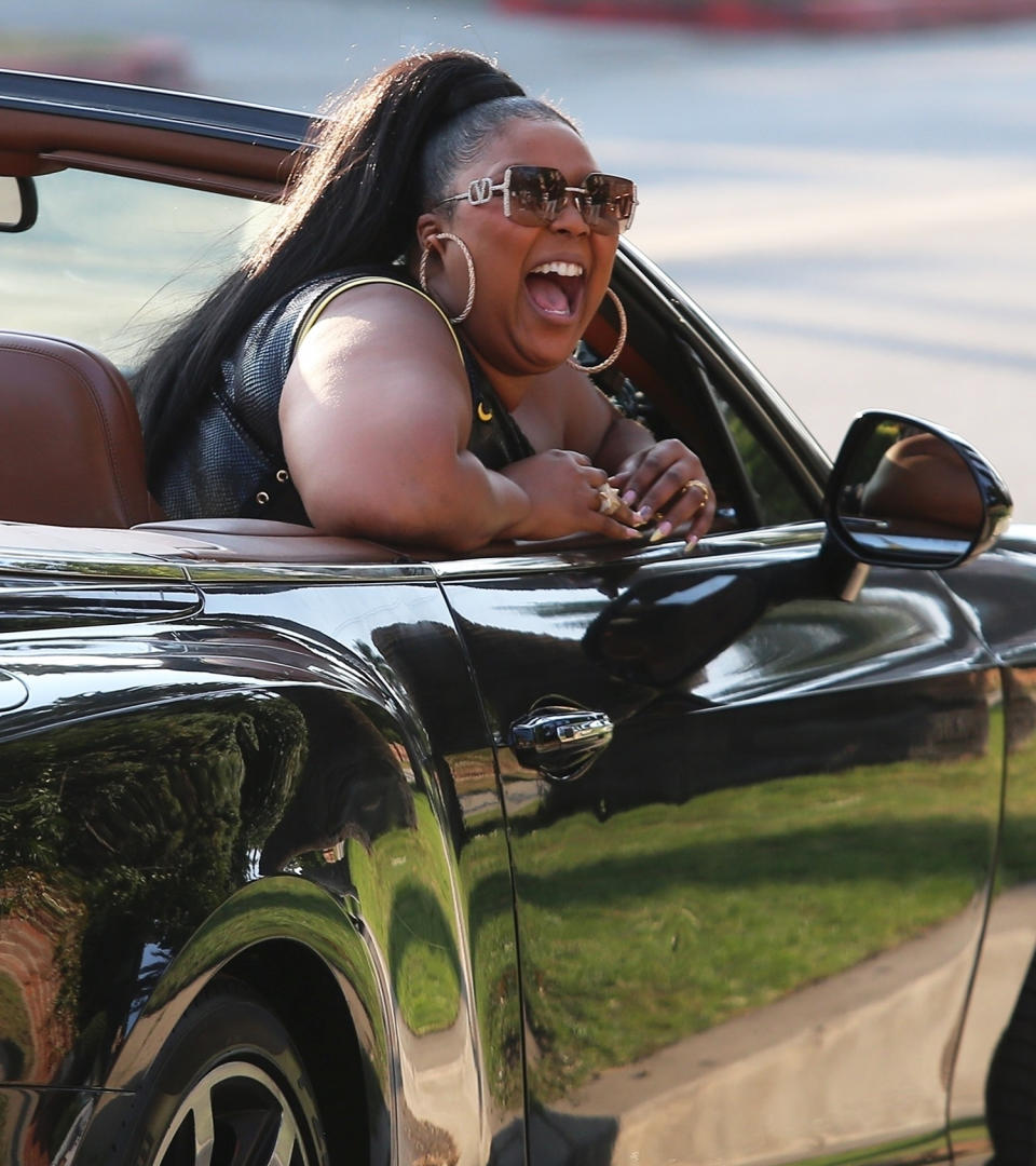 <p>Lizzo rides around in a convertible Bentley enjoying her new song "Rumors" on Rodeo Drive in Beverly Hills.</p>