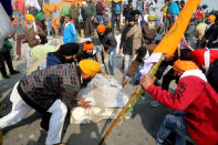 NEW DELHI, INDIA - 2021/01/26: Protesters remove concrete barricades during the demonstration. Thousands of farmers from Punjab and Haryana state continue to protest against the central government's new agricultural Laws. Delhi Police gave permission to protesting farmers' tractor parade on Republic Day. The parade started from Singhu, Tikri and Ghazipur borders points. (Photo by Naveen Sharma/SOPA Images/LightRocket via Getty Images)