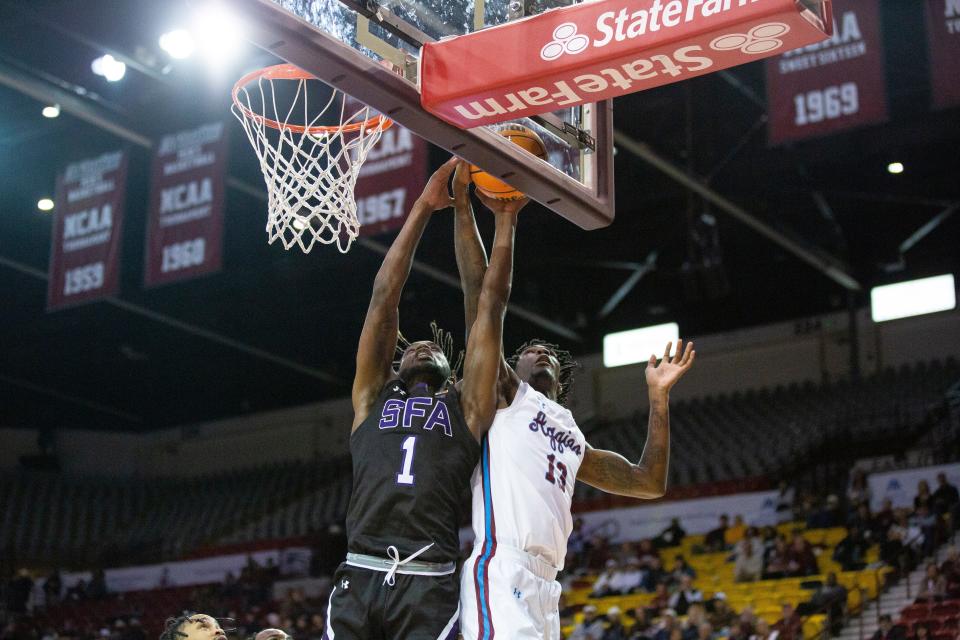 NMSU forward Doctor Bradley reaches for the rebound during a college basketball game on Wednesday, Feb. 1, 2023, at the Pan American Center.