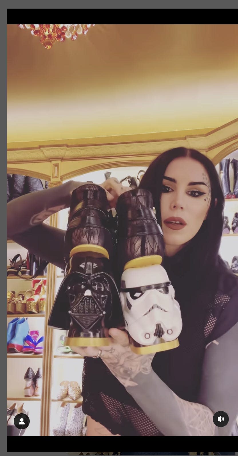 Kat Von D holds a pair of "Star Wars" shoes that she'll be auctioning.