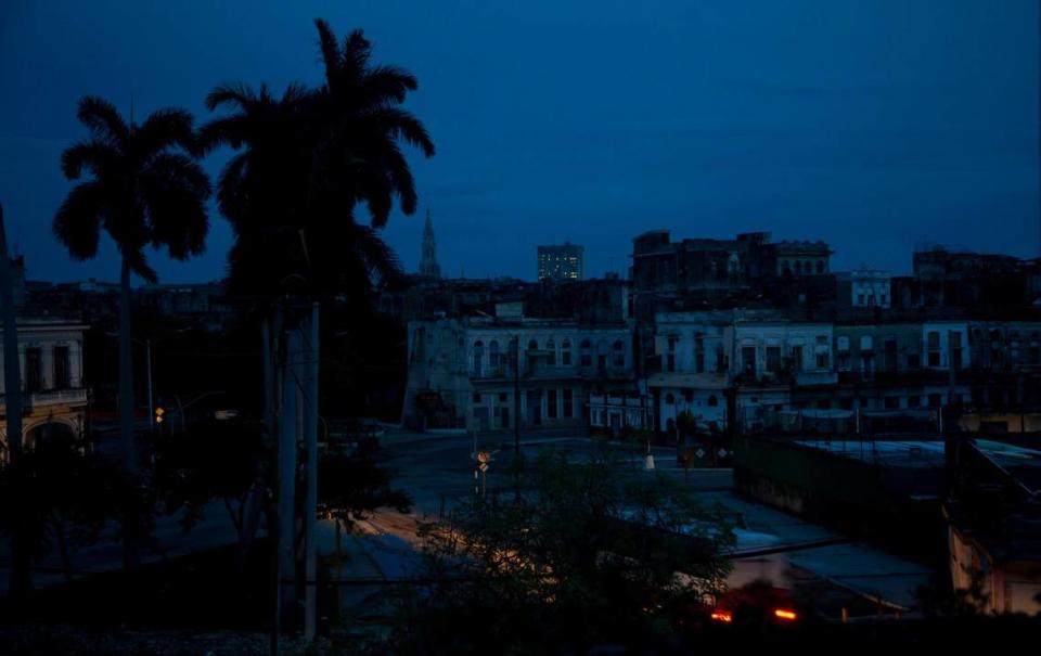 A neighborhood sits dark during a blackout triggered by the passing of Hurricane Ian in Havana, Cuba, early morning Wednesday, Sept. 28, 2022. Hurricane Ian knocked out electricity to the entire island when it hit the island’s western tip as a major storm.
