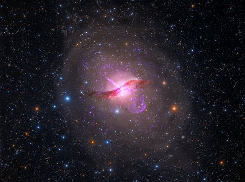 <span class="caption">Centaurus A.</span> <span class="attribution"><span class="source">: X-ray: NASA/CXC/SAO; Optical: Rolf Olsen; Infrared: NASA/JPL-Caltech</span></span>