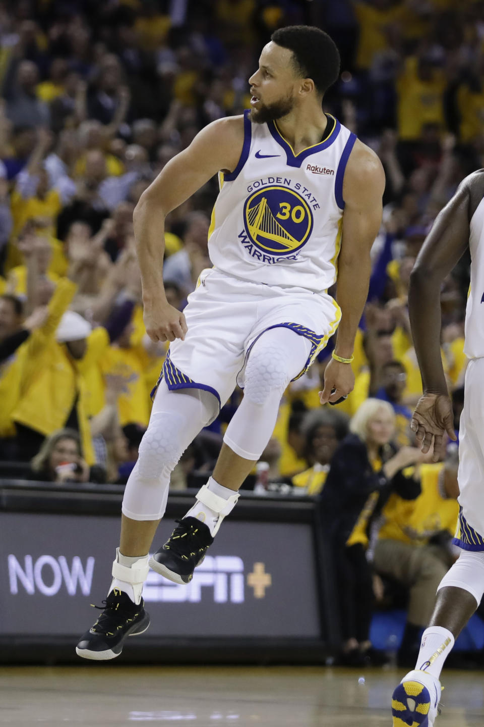 Golden State Warriors guard Stephen Curry (30) celebrates after making a 3-point basket against the Toronto Raptors during the first half of Game 3 of basketball's NBA Finals in Oakland, Calif., Wednesday, June 5, 2019. (AP Photo/Ben Margot)