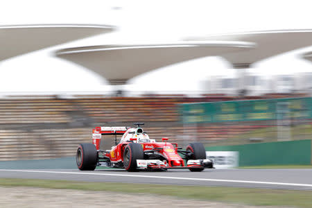 Ferrari Formula One driver Sebastian Vettel of Germany drives during the second practice session. REUTERS/Aly Song