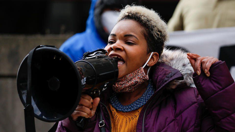 India Walton speaks through a megaphone as she campaigns to replace four-term Mayor Byron Brown, in Buffalo, New York on December 15, 2020. (Reuters/Lindsay DeDario)