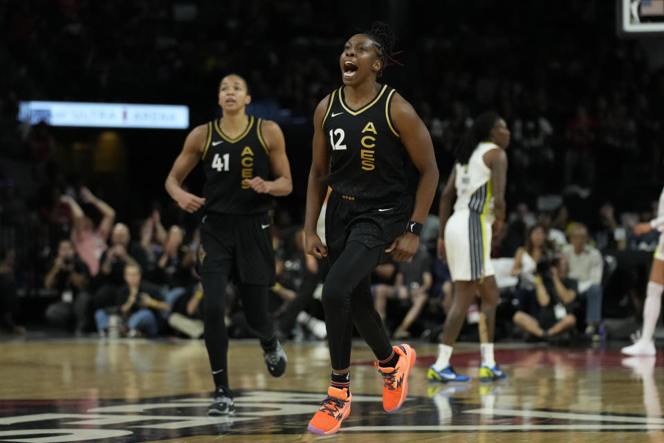 Las Vegas Aces guard Chelsea Gray (12) celebrates after a play against the Dallas Wings during the second half in Game 2 of a WNBA basketball semifinal series Tuesday, Sept. 26, 2023, in Las Vegas. (AP Photo/John Locher)