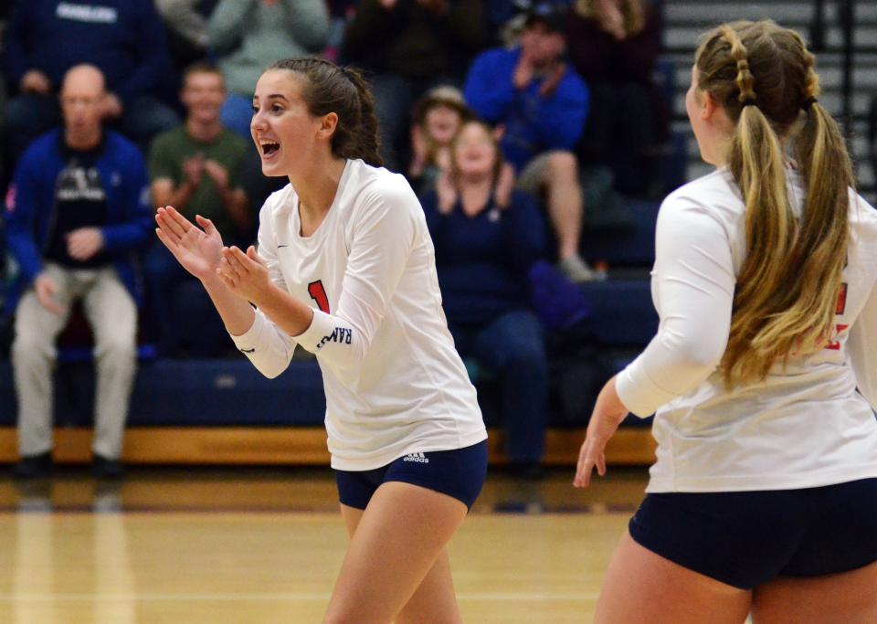 Boyne City senior Ava Tarsi celebrates a point earned by a teammate during Tuesday's senior night match against Harbor Springs.