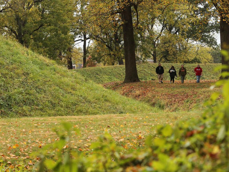 John Badgley, from left, Marisa Badgley, John Badgley Sr. and Noah Badgley, from Dayton, walk the perimeter of the Great Circle on Sunday, October 15, 2023. The Ohio History Connection held events at the Great Circle and Octagon Earthworks to celebrate their designation as UNESCO World Heritage Sites.