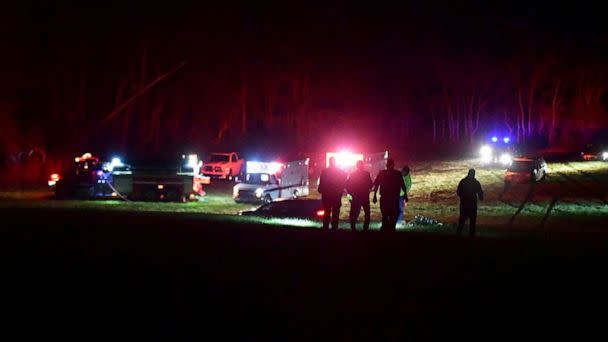 PHOTO: First responders at the site after helicopters crashed in Trigg County, Ky., March 29, 2023. (WKDZ Radio via Reuters)