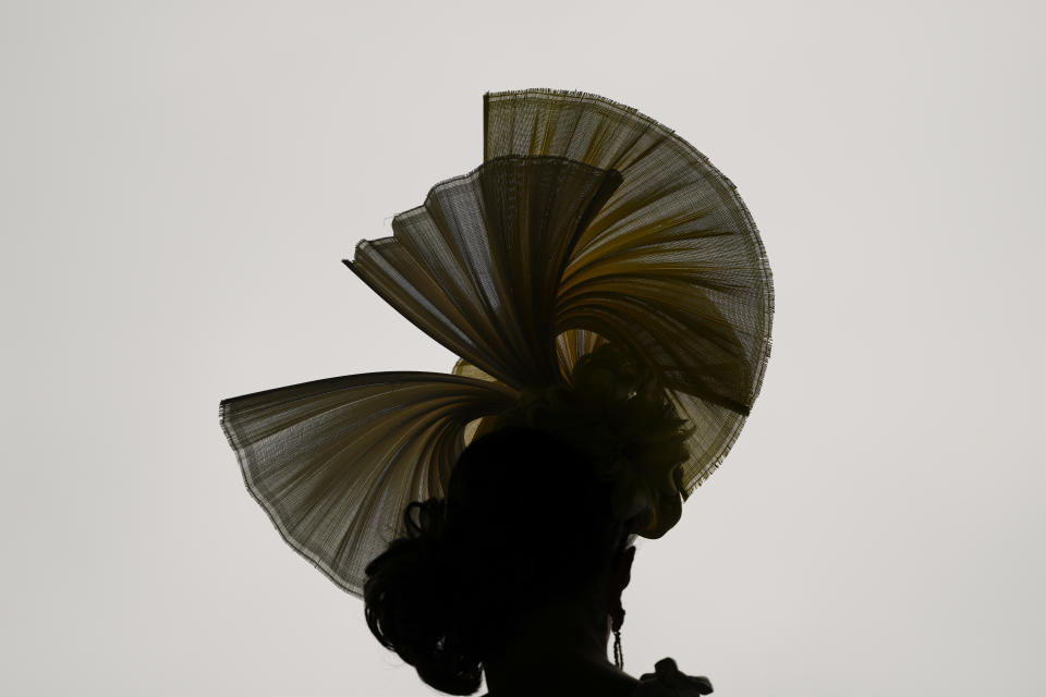 A race fan walks though the stands at Churchill Downs before the 150th running of the Kentucky Derby horse race Saturday, May 4, 2024, in Louisville, Ky. (AP Photo/Charlie Riedel)