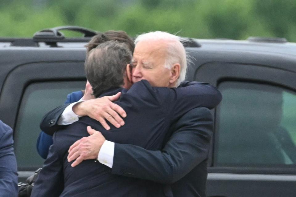 US President Joe Biden hugs his son Hunter Biden upon arrival at Delaware Air National Guard Base in New Castle, Delaware, on June 11, 2024 (AFP via Getty Images)