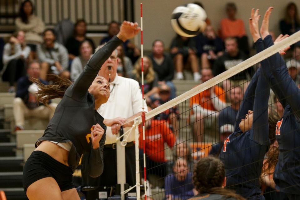 McCutcheon's Chloe Chicoine (2) spikes the ball during the third set of an IHSAA girls volleyball sectional championship match, Saturday, Oct. 16, 2021 in West Lafayette.