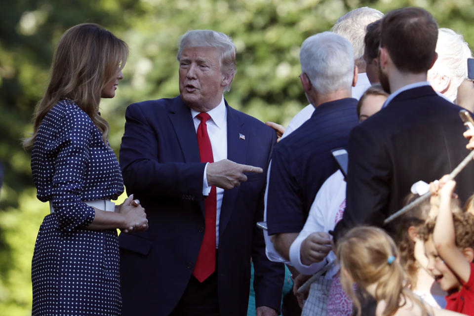 President Donald Trump and first lady Melania Trump greet attendees of the annual Congressional Picnic on the South Lawn of the White House, Friday, June 21, 2019, in Washington. (AP Photo/Jacquelyn Martin)