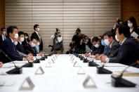 Japan's Prime Minister Shinzo Abe speaks during a meeting about the measures against the coronavirus disease (COVID-19), at the prime minister official residence in Tokyo