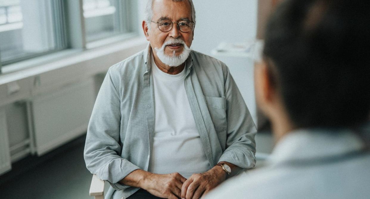 Pancreatic cancer, man sitting at doctors. (Getty Images)