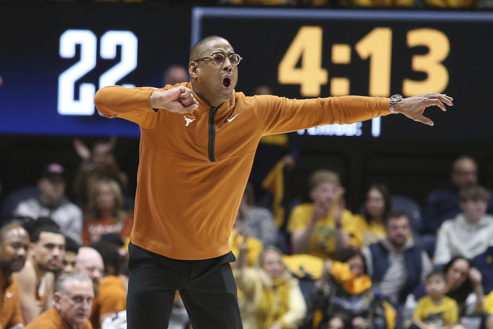 Texas coach Rodney Terry reacts during the first half of an NCAA college basketball game against West Virginia on Saturday, Jan. 13, 2024, in Morgantown, W.Va. (AP Photo/Kathleen Batten)