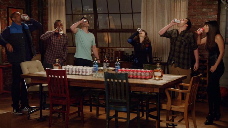 A screenshot of (from left to right) Coach, Winston, Schmidt, Jess, Nick and Cece all throwing back beers while playing True American on New Girl.