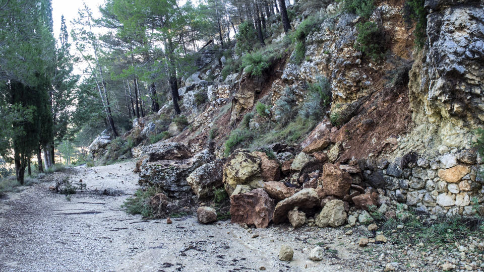 Road of mountain cut by a landslide of rocks and mud for the strong rains