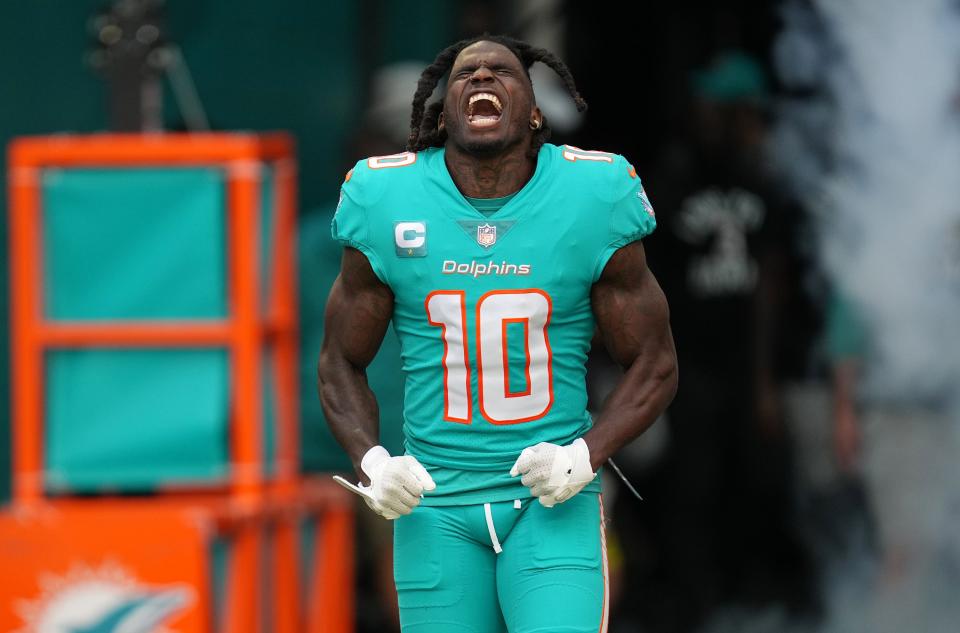 Miami Dolphins wide receiver Tyreek Hill (10) takes the field before the start of the game against the New York Jets at Hard Rock Stadium in Miami Gardens, Jan. 8, 2023. 