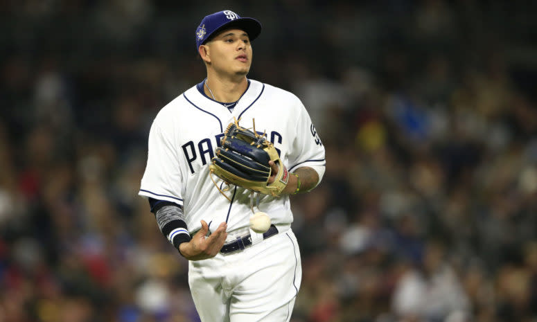 Manny Machado tossing the ball around during a game.