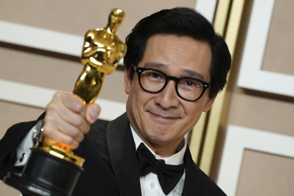 Ke Huy Quan, winner of the award for best performance by an actor in a supporting role for "Everything Everywhere All at Once" poses in the press room at the Oscars on Sunday, March 12, 2023, at the Dolby Theatre in Los Angeles. (Photo by Jordan Strauss/Invision/AP)