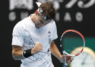 Austria's Dominic Thiem reacts after winning a point against Kazakhstan's Mikhail Kukushkin during their first round match at the Australian Open tennis championship in Melbourne, Australia, Monday, Feb. 8, 2021.(AP Photo/Rick Rycroft)