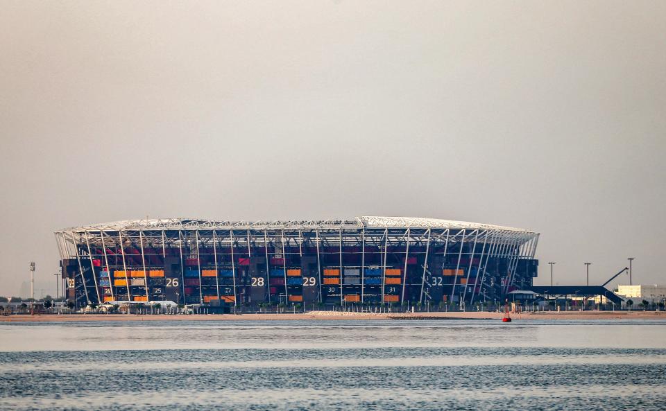 This picture taken early on August 4, 2022 from the Gulf waters off Qatar's capital Doha shows a view of 974 Stadium, formerly knows as Ras Abu Aboud, which will host matches of the FIFA football World Cup 2022. - Qatar on August 12 marks 100 days remaining until the start of the 2022 FIFA World Cup. (Photo by MUSTAFA ABUMUNES / AFP) (Photo by MUSTAFA ABUMUNES/AFP via Getty Images)