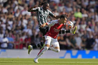 FILE - Manchester United's Aaron Wan-Bissaka, left, and Arsenal's Gabriel Martinelli vie for the ball during the English Premier League soccer match between Arsenal and Manchester United at Emirates stadium in London, Sunday, Sept. 3, 2023. A fourth-straight Premier League title for Manchester City marks an unprecedented period of dominance by one team in English soccer. (AP Photo/Kirsty Wigglesworth, File)