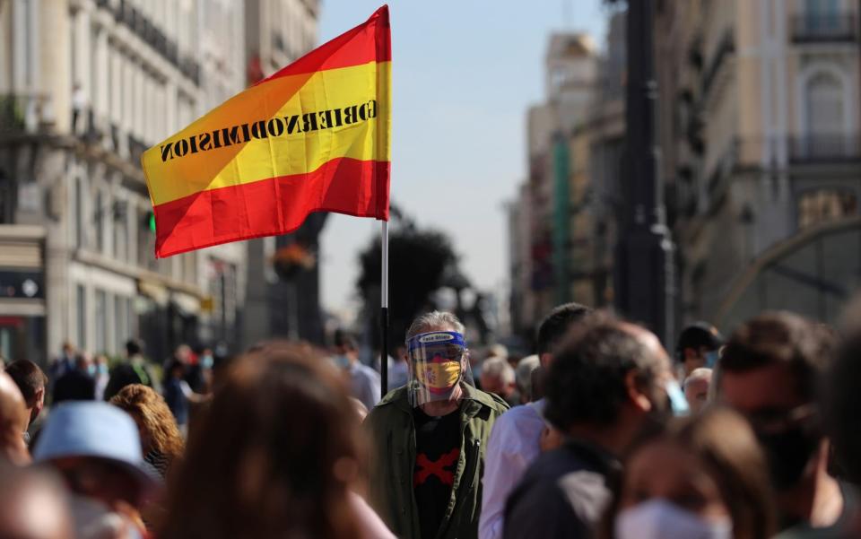 Protesters in Madrid demonstrate against restrictions imposed as coronavirus cases in the city rise - Rodrigo Jimenez/Shutterstock