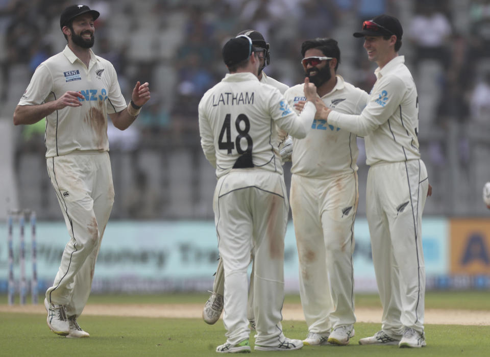 New Zealand's Ajaz Patel , second from right, celebrates the dismissal of India's Jayant Yadav with his team player during the day two of their second test cricket match with India in Mumbai, India, Saturday, Dec. 4, 2021.(AP Photo/Rafiq Maqbool)