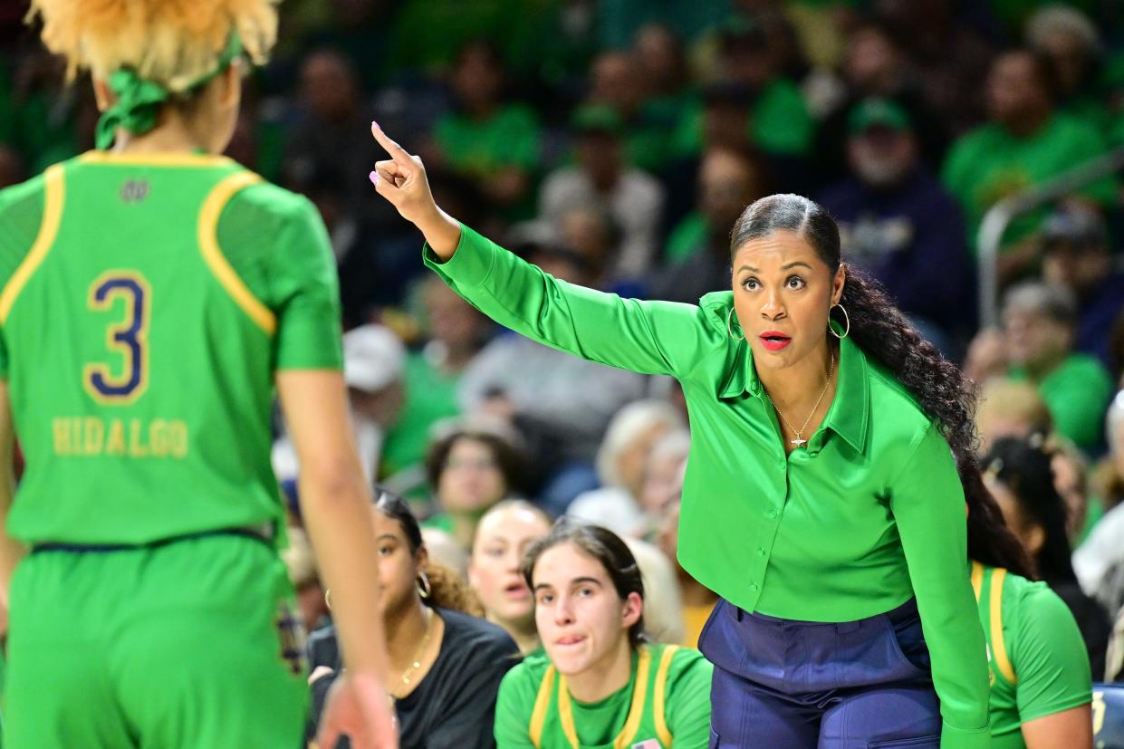 Notre Dame Fighting Irish head coach Niele Ivey talks to guard Hannah Hidalgo (3) in the first half against the Virginia Tech Hokies at the Purcell Pavilion.