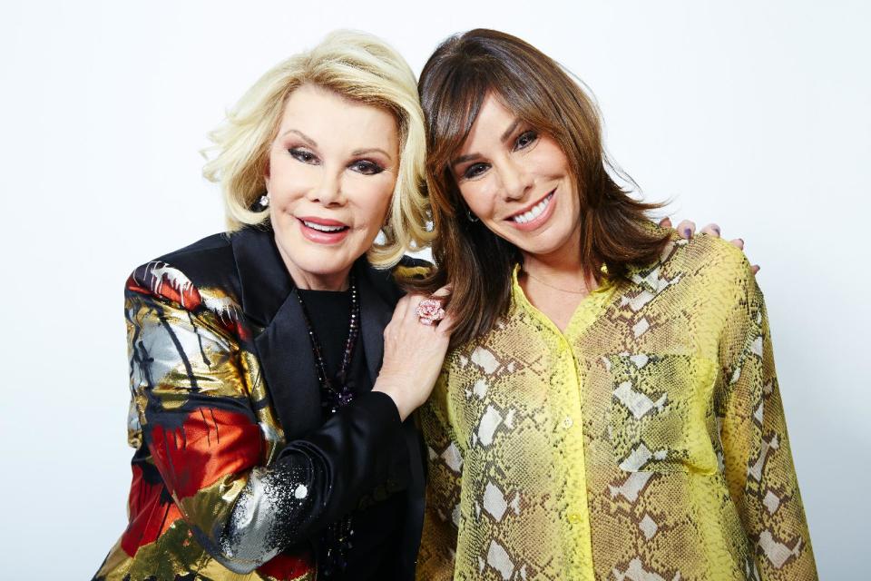 This Feb. 21, 2013 photo shows comedian Joan Rivers, left, and her daughter Melissa Rivers in New York. Joan leads a panel on "Fashion Police," with Giuliana Rancic, Kelly Osbourne and stylist George Kotsiopoulos as they critique celebrity style choices. Melissa is a co-executive producer and occasional panelist as well. (Photo by Dan Hallman/Invision/AP)