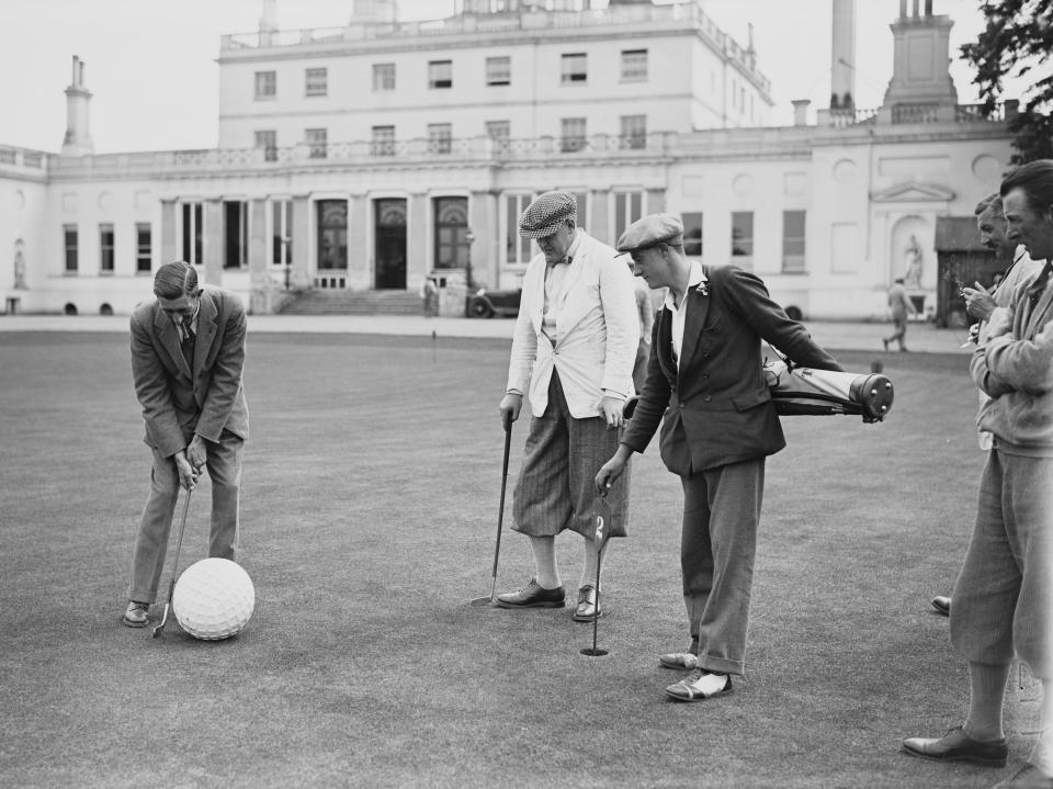 Members of the Fleetway House Golfing Society play with a giant golf ball on the putting green in 1928.