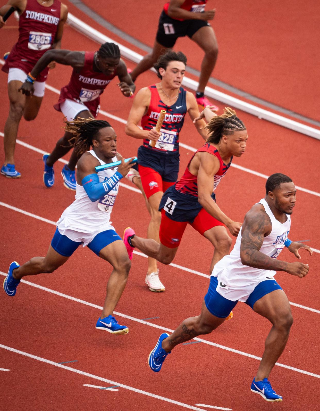 Humble Atascocita's Jelani Watkins, middle, anchored a UIL state track meet record of 39.14 in the 400-meter relay at the Class 6A state track meet on Saturday. Watkins also won the 100 and 200. He will play football at LSU this fall.