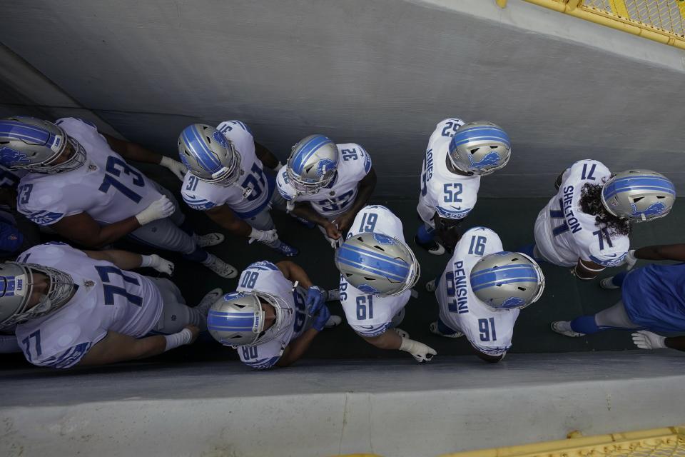 Detroit Lions players wait in the tunnel to be introduced before an NFL football game against the Green Bay Packers Sunday, Sept. 20, 2020, in Green Bay, Wis. (AP Photo/Morry Gash)