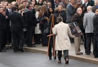 NEWTOWN, CT - DECEMBER 18: People arrive for the funeral for shooting victim Jessica Rekos, 6, at the St. Rose of Lima Catholic church on December 18, 2012 in Newtown, Connecticut. Funeral services were held at the church for both Jessica Rekos and James Mattioli, 6, Tuesday, four days after 20 children and six adults were killed at Sandy Hook Elementary School. (Photo by John Moore/Getty Images)