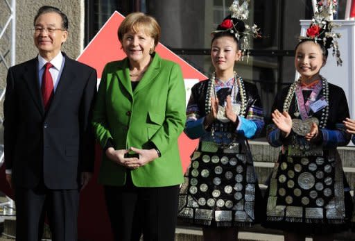 German Chancellor Angela Merkel (2nd L) and Chinese Premier Wen Jiabao (L) at the opening of the Hannover Messe on April 22. Having already inked an accord with Iceland on cooperation in the oil-rich Arctic region and opened the Hannover Messe, Wen will now turn his attention to the Europe's up-and-coming ex-communist East