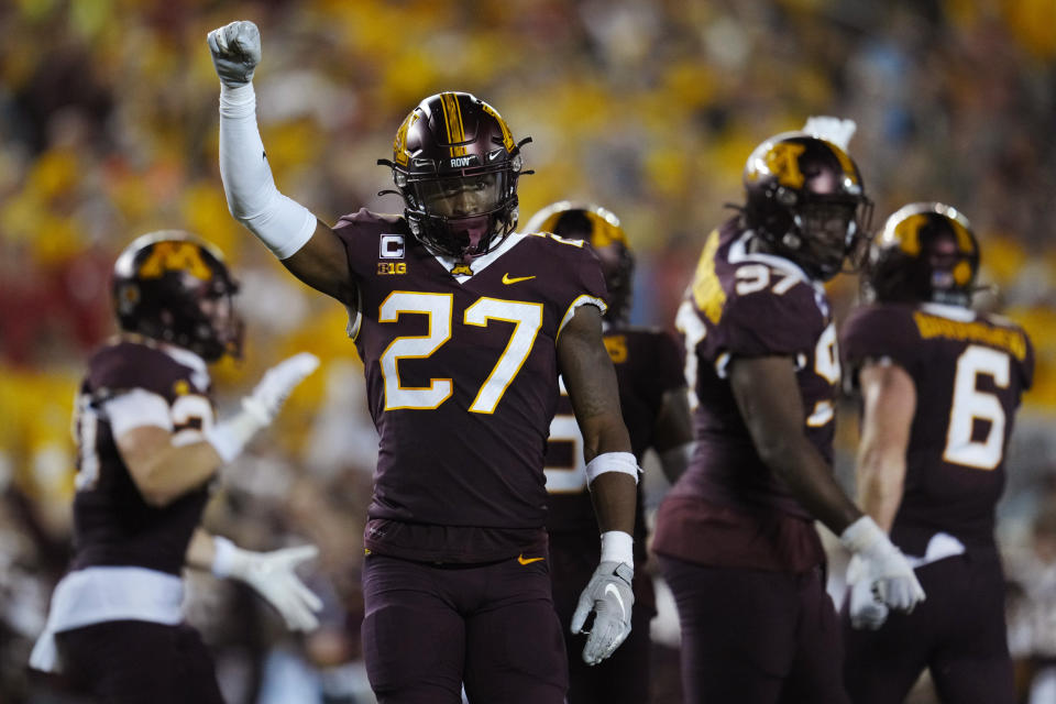 Minnesota defensive back Tyler Nubin (27) celebrates a stop against Nebraska on third down during the second half of an NCAA college football game Thursday, Aug. 31, 2023, in Minneapolis. (AP Photo/Abbie Parr)